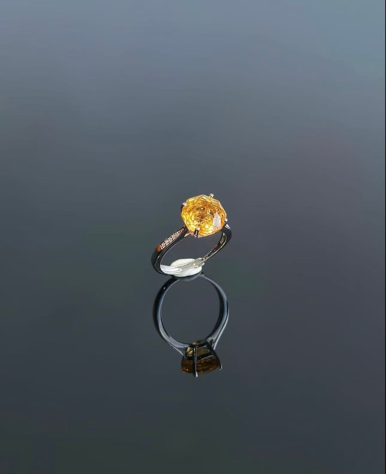 Yellow ring reflected on a dark surface