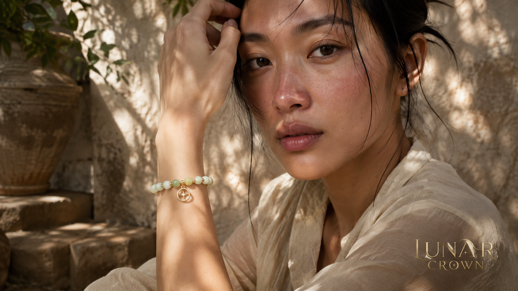 Pale green beaded bracelet in soft courtyard light