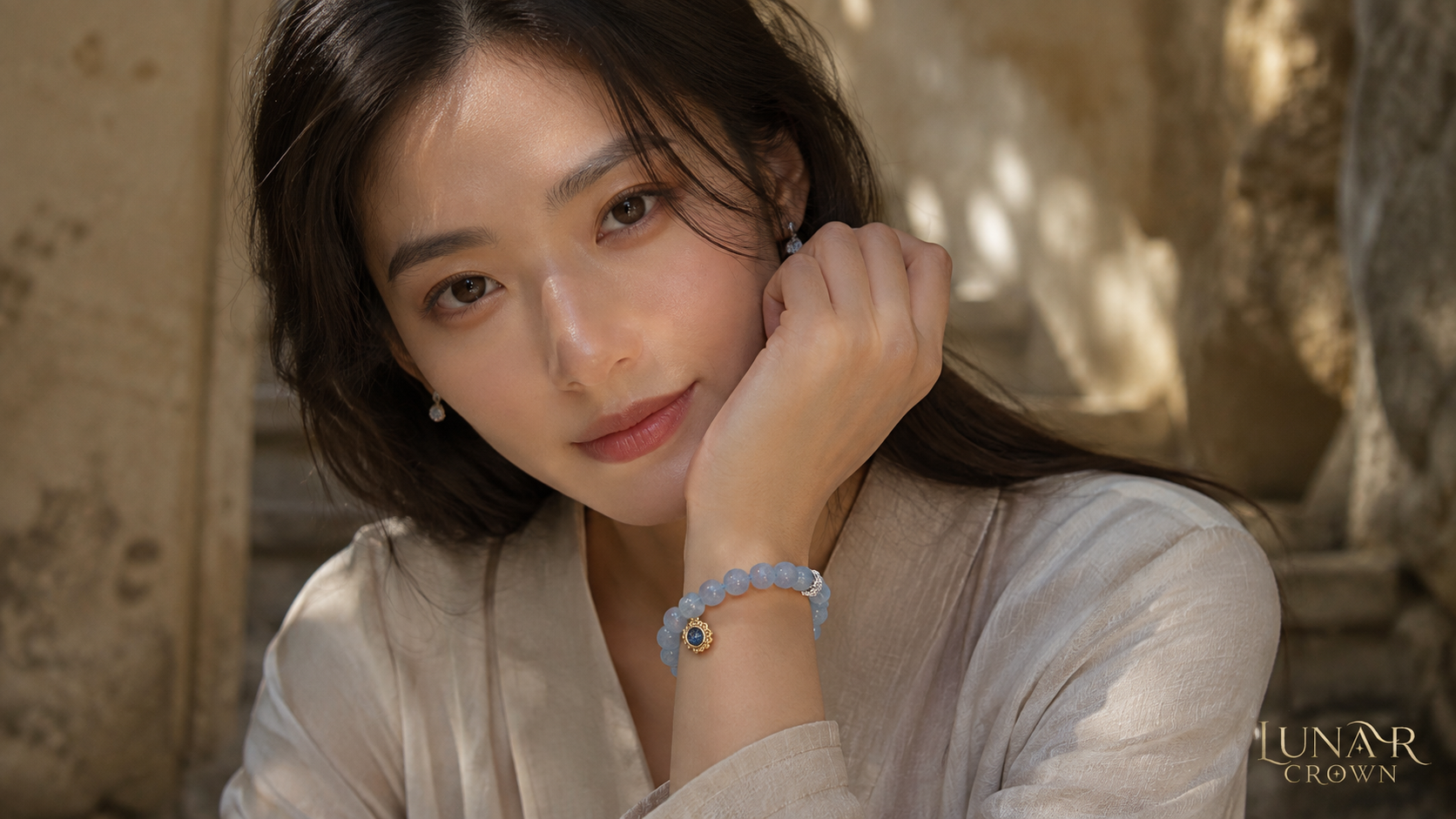 Model wearing a blue beaded bracelet